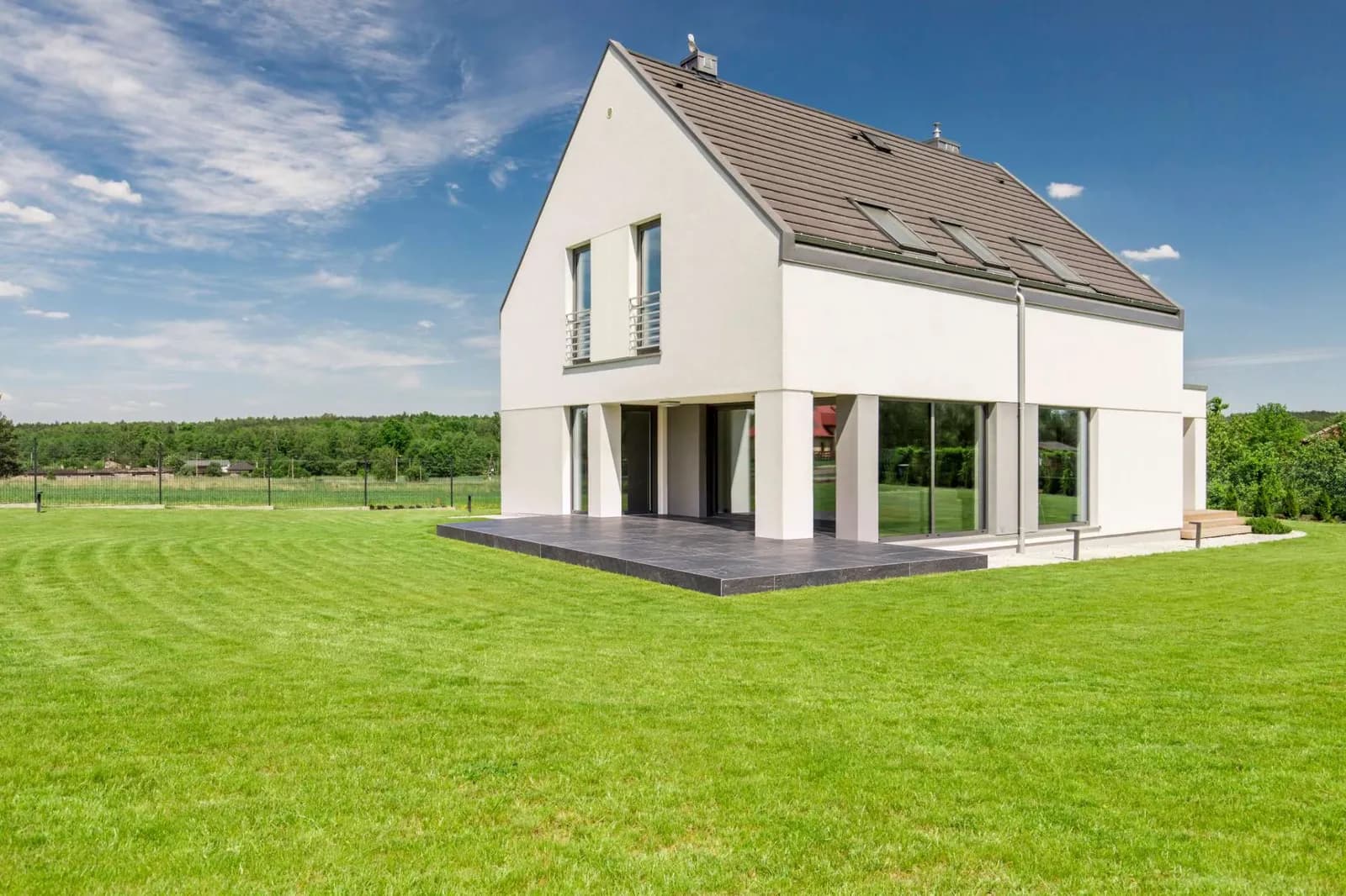 The same garden with a dark natural stone terrace instead of the wooden terrace